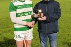Evan O'Shea MOTM U21 A Hurling Final receiving his award from Declan O'Neill