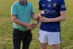 Luke Farrelly of Ballinhassig receiving his MOTM award following the JAHL Final from Declan O'Neill