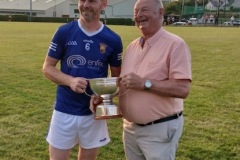 Ballinhassig- Captain Michael Sheehan receiving the JAHL trophy from Myles Barry