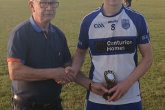 Conor O'Donovan being named Man of the Match after the JBFL Final with Sponsor Declan O'Neill