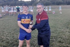 Carrigaline's Eoghan Aherne receiving his Man of the Match Award from Communications Officer Sean Nyhan following the U21 A Football Final