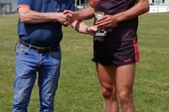 Declan O'Neill awarding the Man of the Match to Senan Buckley of Crosshaven after JBHL Final