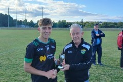 Oisín Buckley receiving his Man of the Match award from our Treasurer Declan O'Neill of O'Neill Fitted Furniture & Kitchens